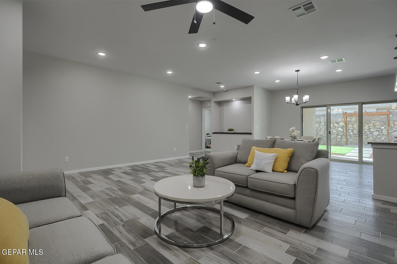 13896 Sky Ranger Avenue El Paso, TX 79928 - Photo 6 of 30 a living room with furniture and a view of kitchen