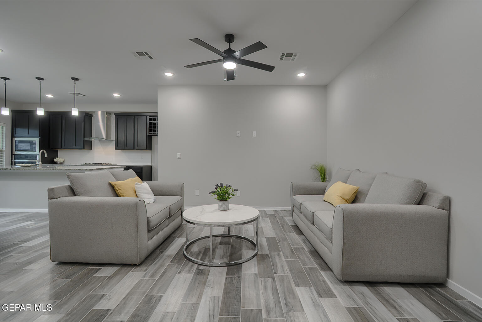13896 Sky Ranger Avenue El Paso, TX 79928 - Photo 7 of 30 a living room with furniture and a wooden floor