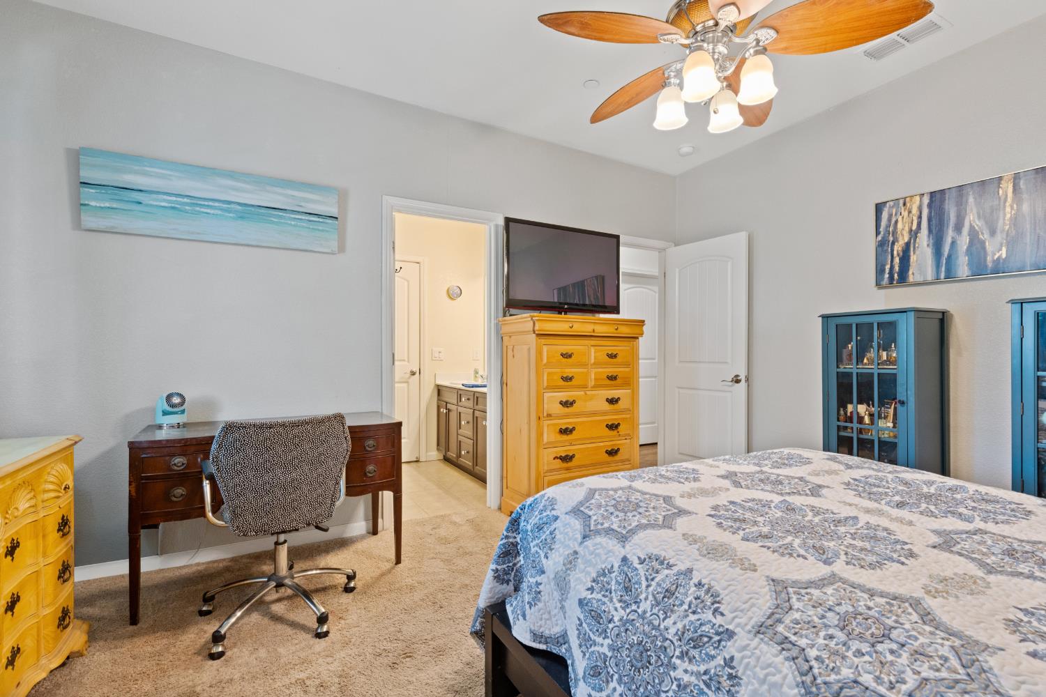 2011 Roy Ranch Way Plumas Lake, CA 95961 - Photo 20 of 49 a bedroom with a bed and a chandelier