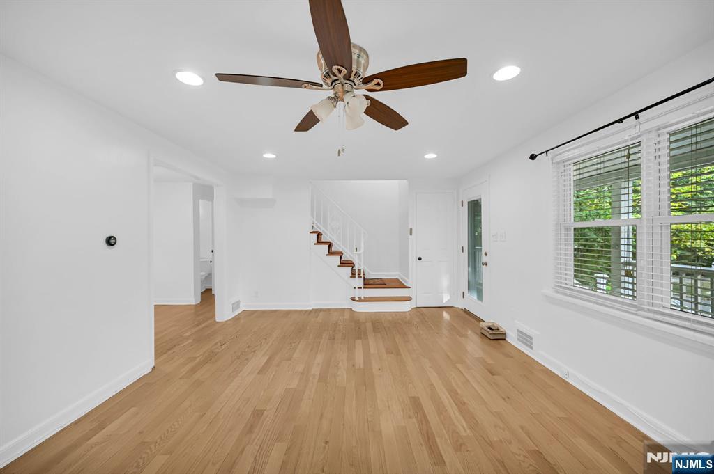3 Country Club Road Livingston, NJ 07039 - Photo 7 of 37 a view of empty room with wooden floor and fan