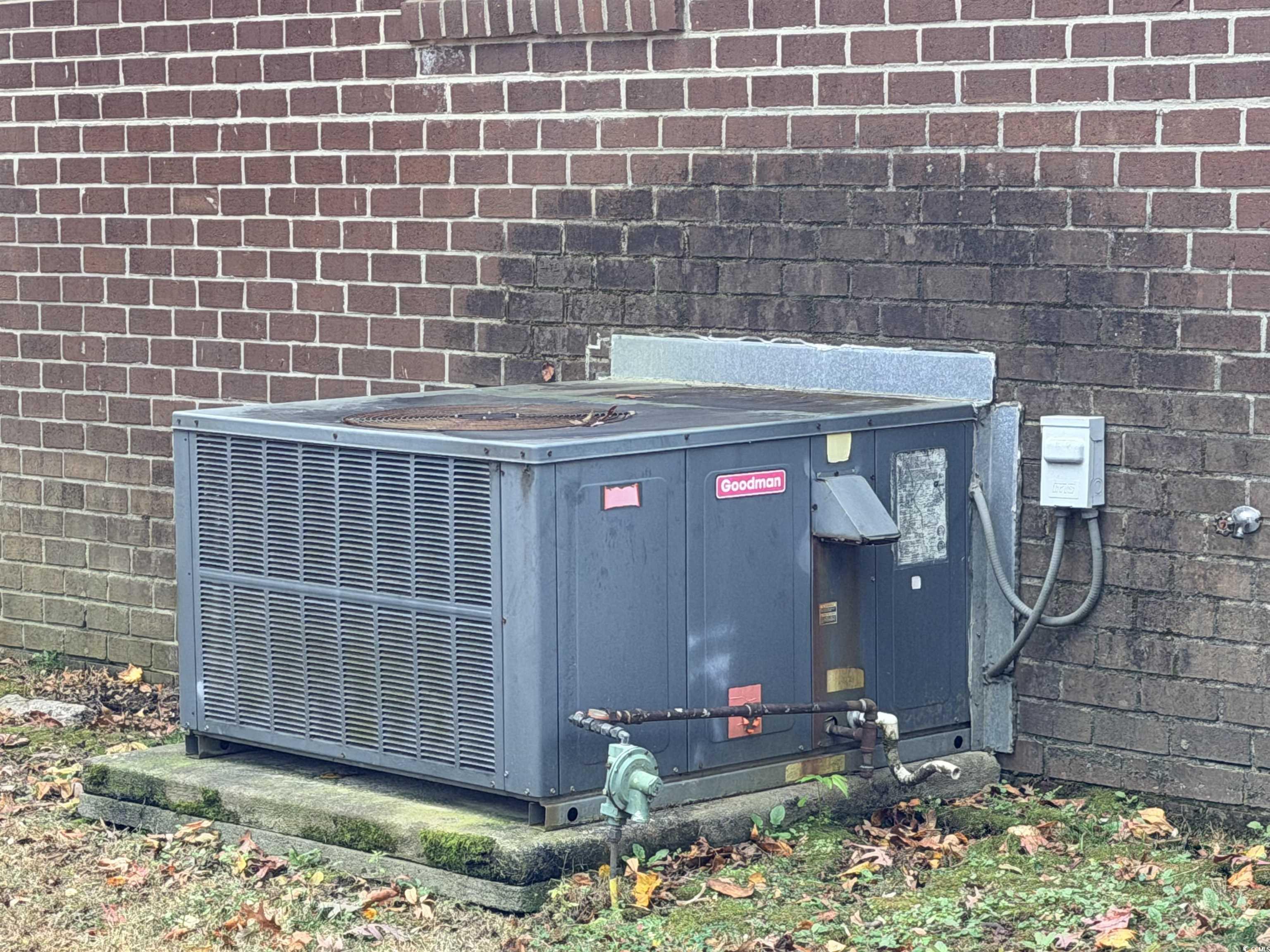 107 Aster Drive Greer, SC 29651 - Photo 19 of 20 Exterior view of a central air condition unit and brick siding