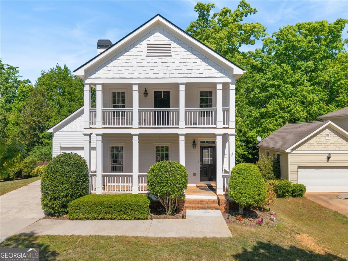 728 Markhams Drive Madison, GA 30650 - Photo 1 of 51 a front view of a house with garden