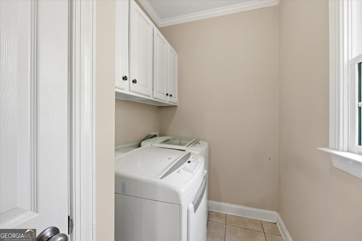 728 Markhams Drive Madison, GA 30650 - Photo 11 of 51 a utility room with dryer and washer
