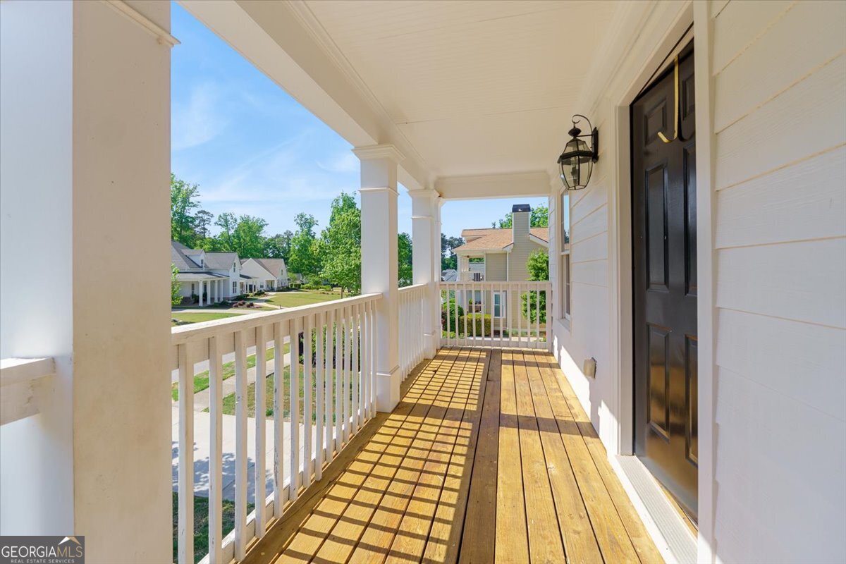 728 Markhams Drive Madison, GA 30650 - Photo 20 of 51 a view of a balcony with wooden floor