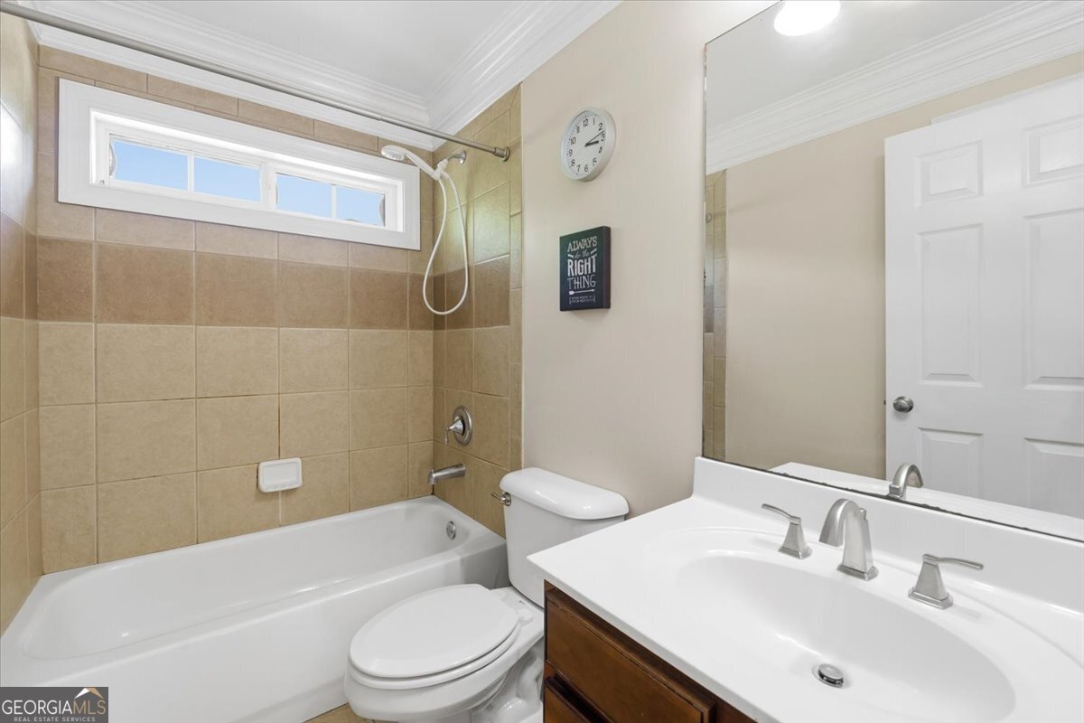 728 Markhams Drive Madison, GA 30650 - Photo 28 of 51 a bathroom with a sink a toilet and shower