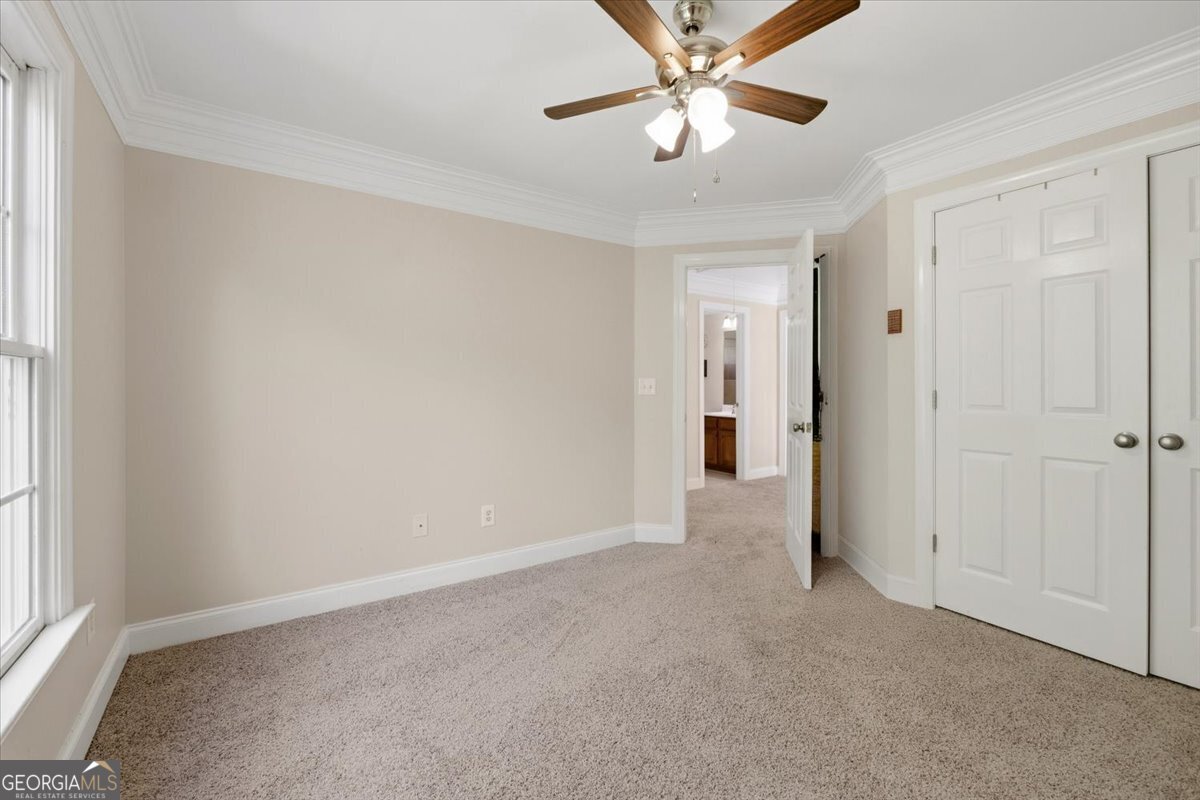 728 Markhams Drive Madison, GA 30650 - Photo 30 of 51 an empty room with chandelier fan