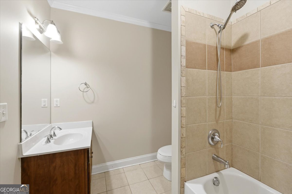 728 Markhams Drive Madison, GA 30650 - Photo 32 of 51 a bathroom with a sink toilet and shower