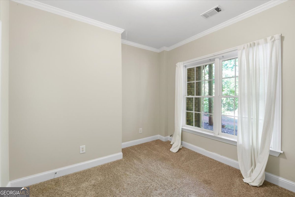728 Markhams Drive Madison, GA 30650 - Photo 33 of 51 a view of room with window