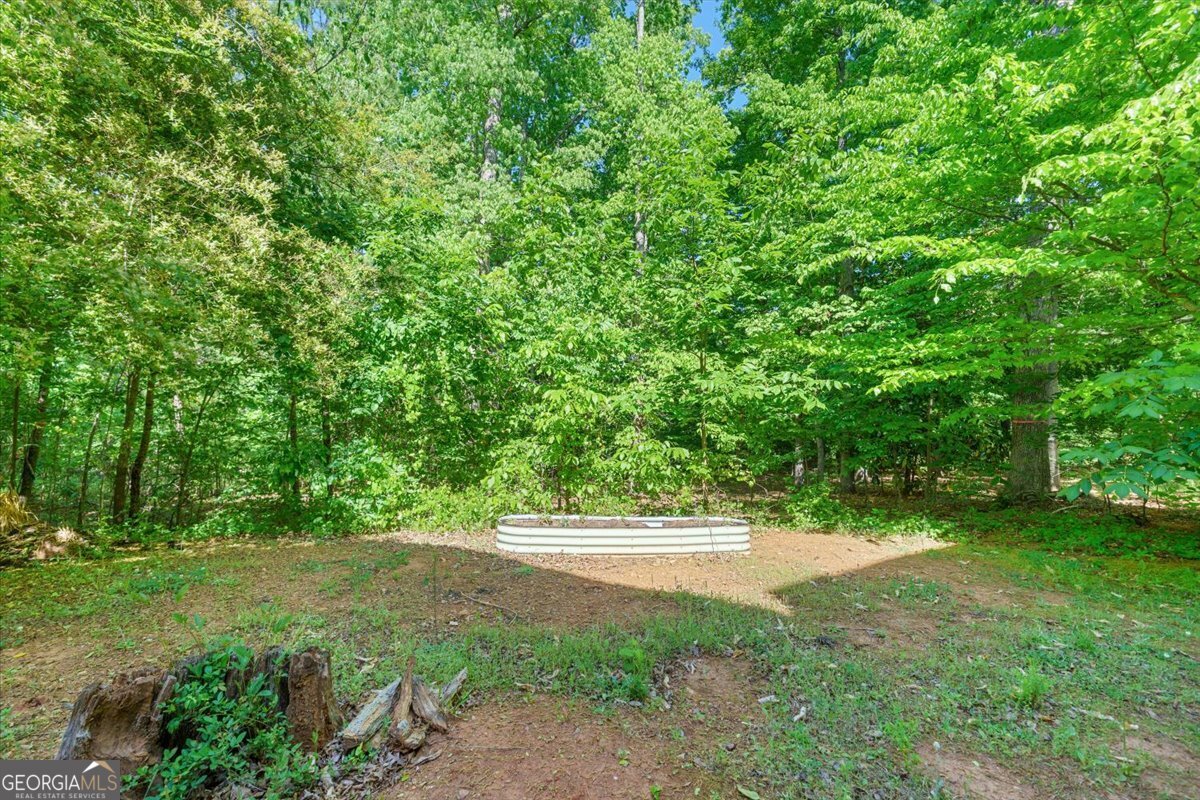 728 Markhams Drive Madison, GA 30650 - Photo 37 of 51 a view of outdoor space with deck and yard