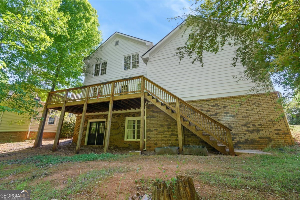 728 Markhams Drive Madison, GA 30650 - Photo 38 of 51 a view of a house with a yard