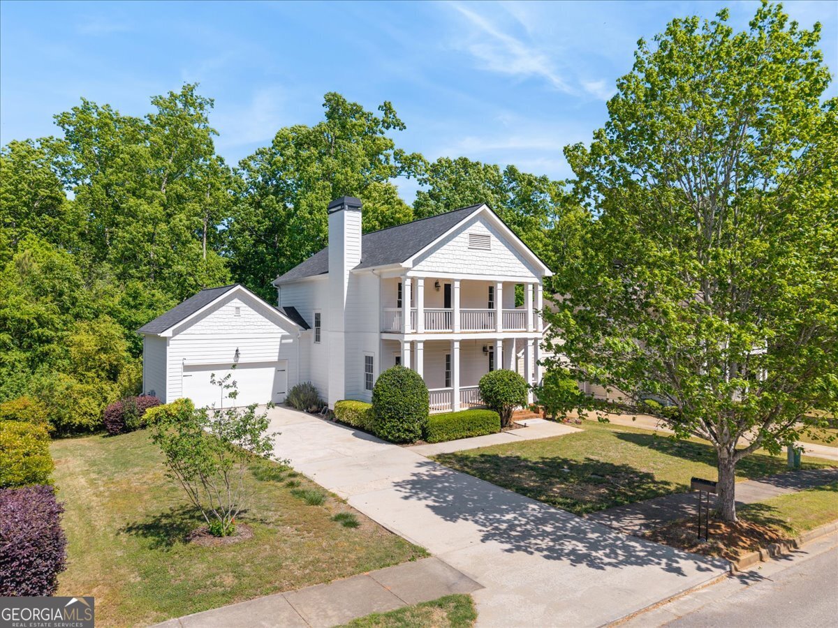 728 Markhams Drive Madison, GA 30650 - Photo 39 of 51 a front view of a house with a yard