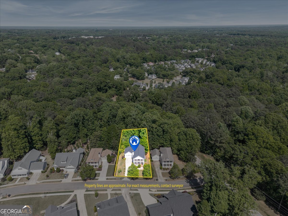 728 Markhams Drive Madison, GA 30650 - Photo 43 of 51 an aerial view of a house with yard