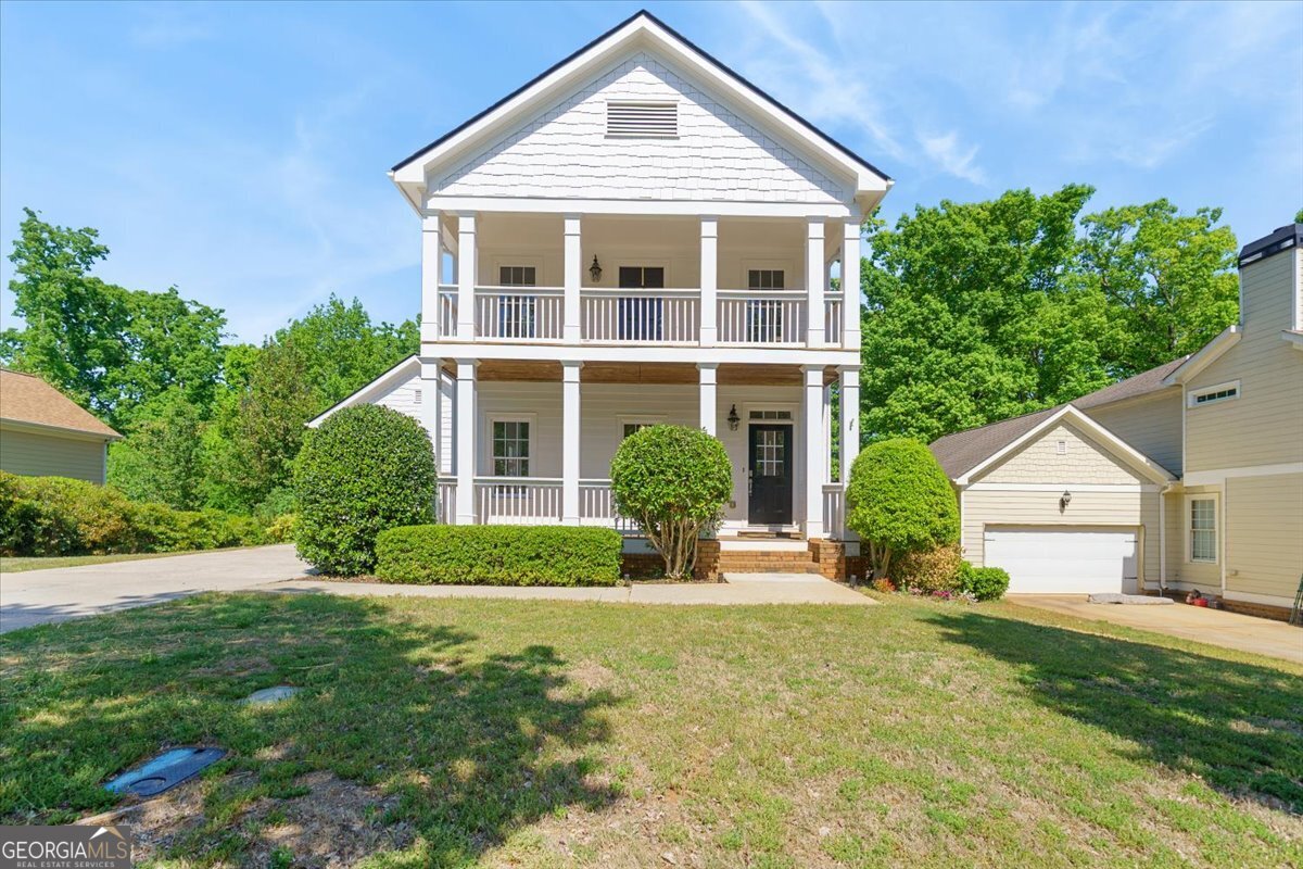 728 Markhams Drive Madison, GA 30650 - Photo 47 of 51 a view of a house with yard and plants
