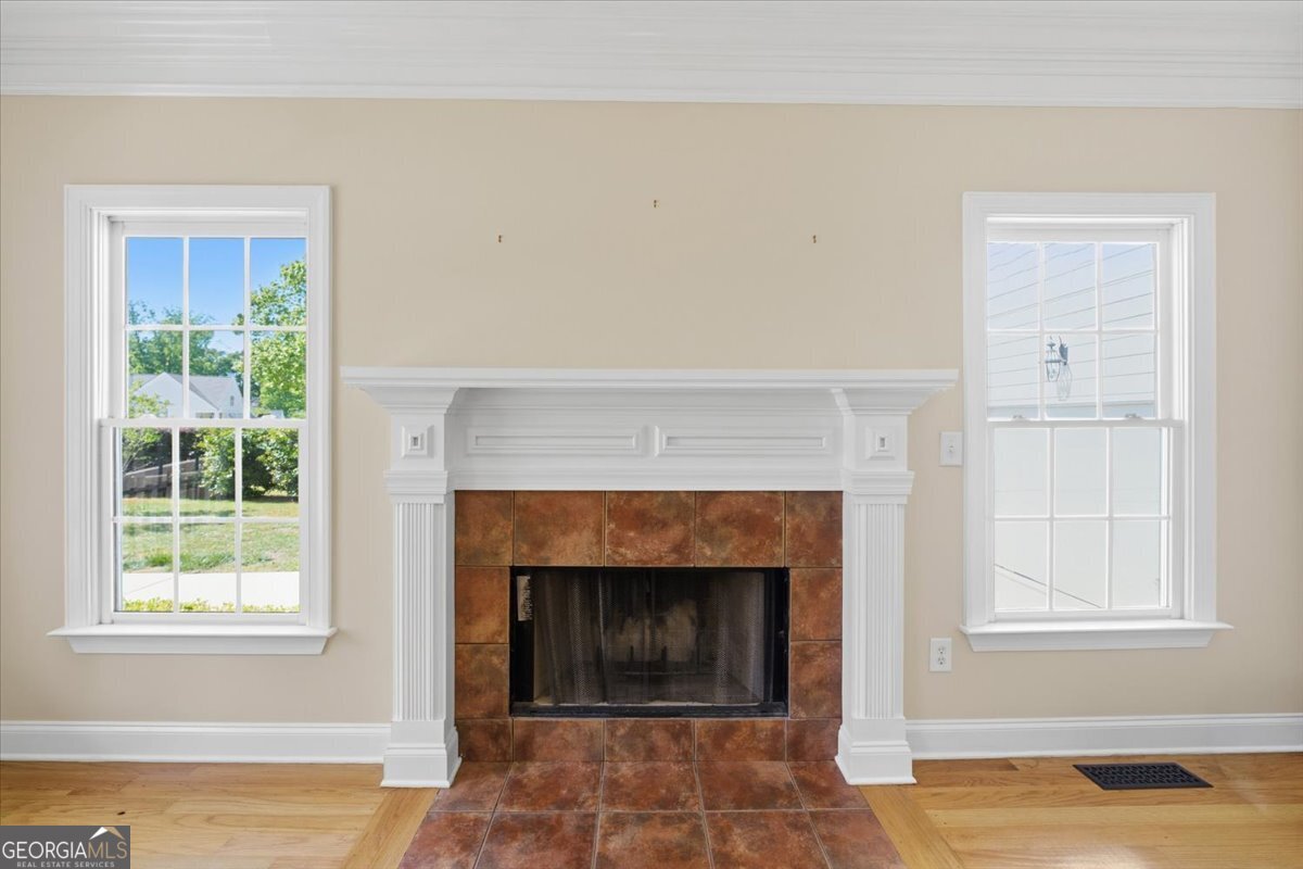 728 Markhams Drive Madison, GA 30650 - Photo 5 of 51 a living room with furniture and a fireplace