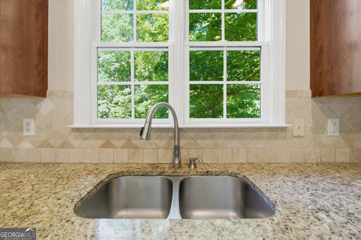 728 Markhams Drive Madison, GA 30650 - Photo 10 of 51 a close view of sink and tap