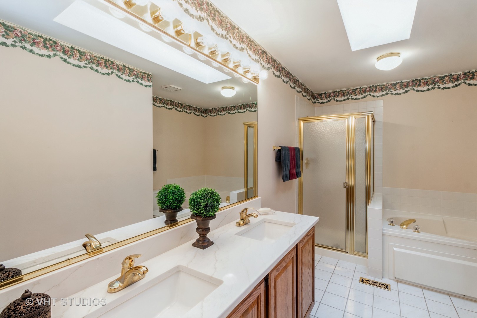 1200 Coldspring Road Elgin, IL 60120 - Photo 20 of 30 a bathroom with a granite countertop sink and a mirror a bathtub