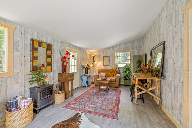 a view of living room with furniture and flat screen tv