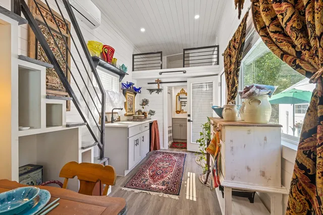 a front view of a house with swimming pool garden and outdoor seating