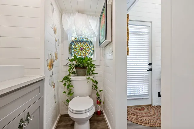 a view of a yard with table and chairs under an umbrella