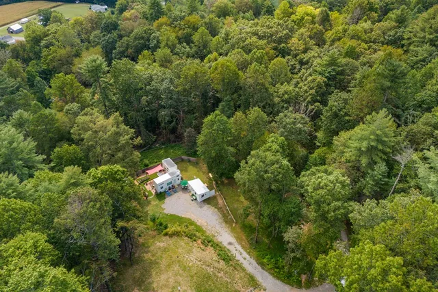 an aerial view of a house with garden