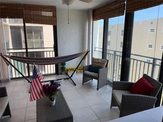 a view of a living room and wooden floor