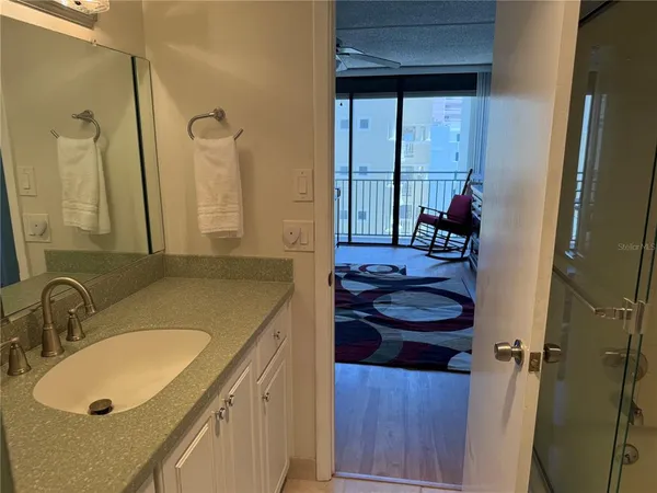 a bathroom with a sink and a mirror