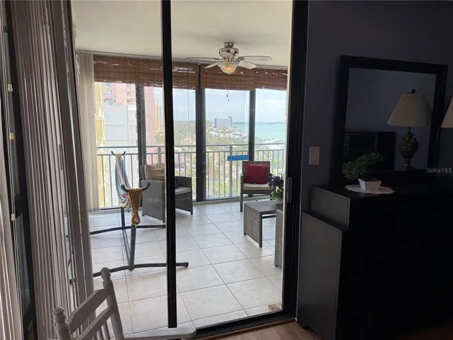 a view of living room with furniture and floor to ceiling window