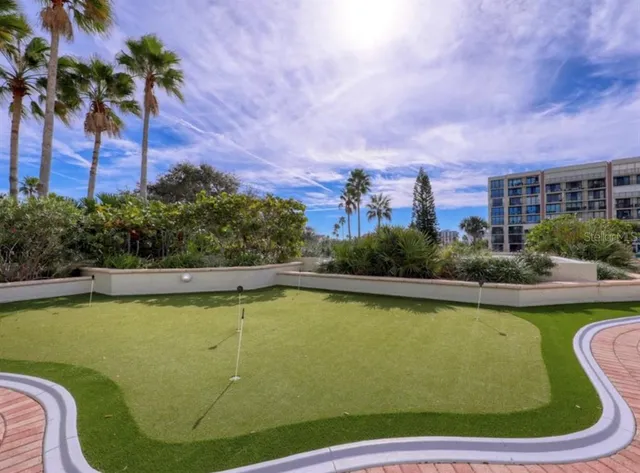 a view of a swimming pool and a chairs