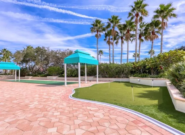 a view of a swimming pool with a yard