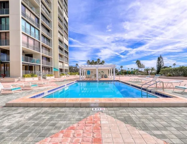 a view of swimming pool with outdoor seating