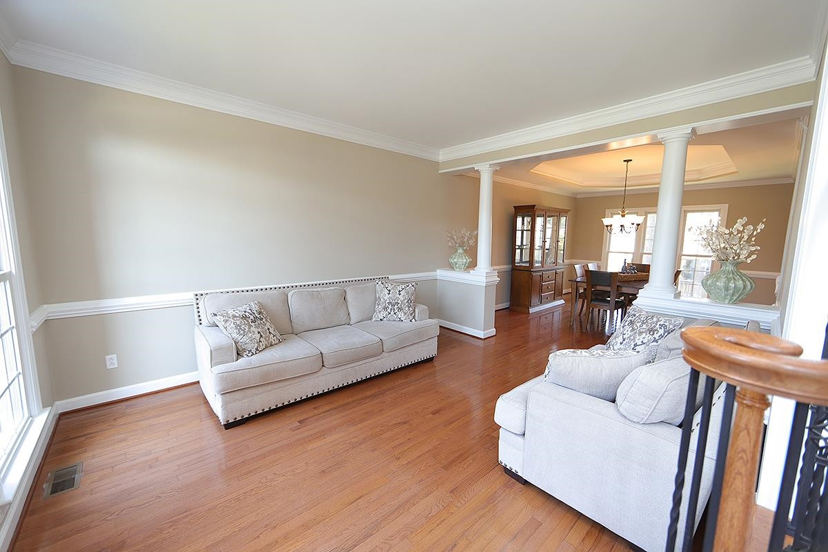6017 Jones Farm Road Wake Forest, NC 27587 - Photo 3 of 25 Dramatic fluted columns separate the 2 formal entertaining rooms, the Living Room and the Dining Room. Don't need a Living Room? Make it the "Wine Room" or flex playroom for the kids. You have options here! Living Room