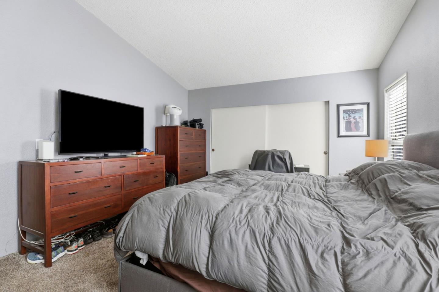 20 Russell Road, Unit 8 Salinas, CA 93906 - Photo 17 of 38 a bedroom with a bed and a flat screen tv