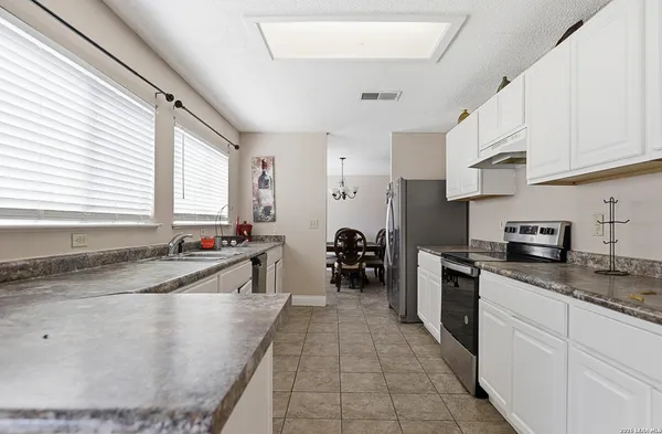a view of a room with furniture and window