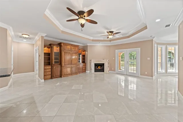 a view of an empty room with a fireplace