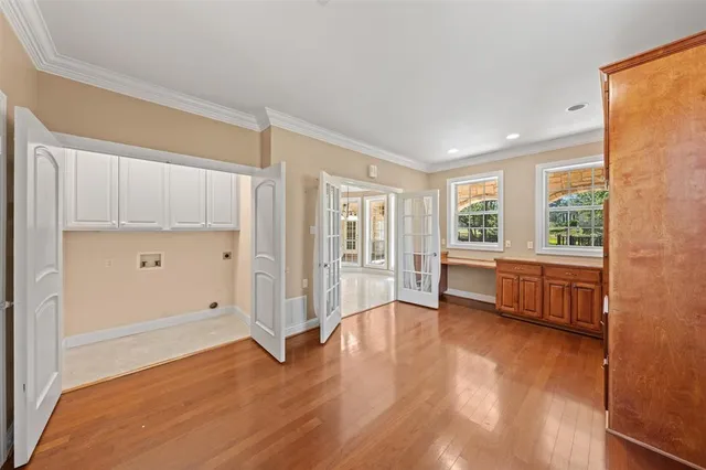a view of a livingroom with a ceiling fan and window