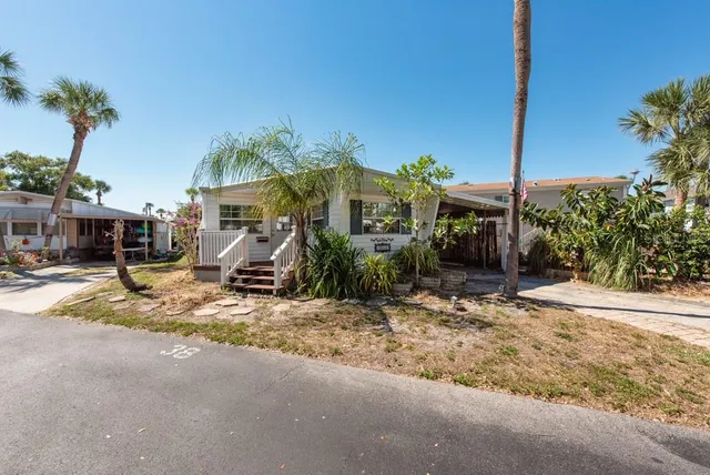 a view of a street with houses on the side