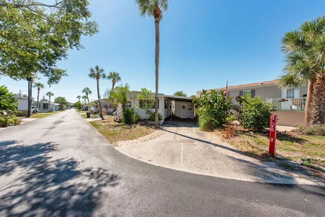 a house view with a sitting space and garden space