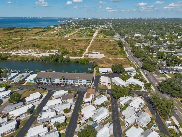 an aerial view of residential houses with city view