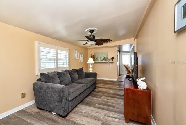 a living room with furniture and a window
