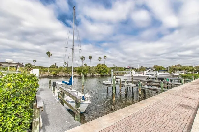 a view of a lake with a table and chairs