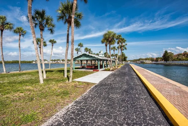 a roof deck with table and chairs