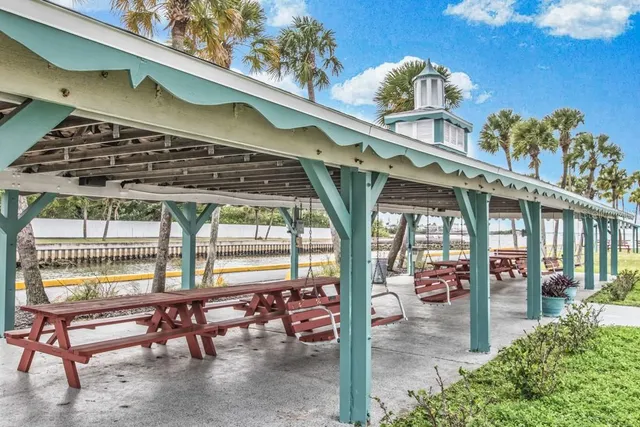 a view of an swimming pool and an outdoor seating