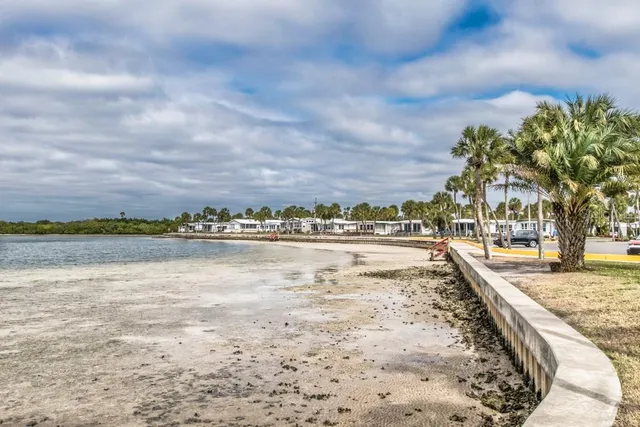a swimming pool with outdoor seating yard and barbeque oven