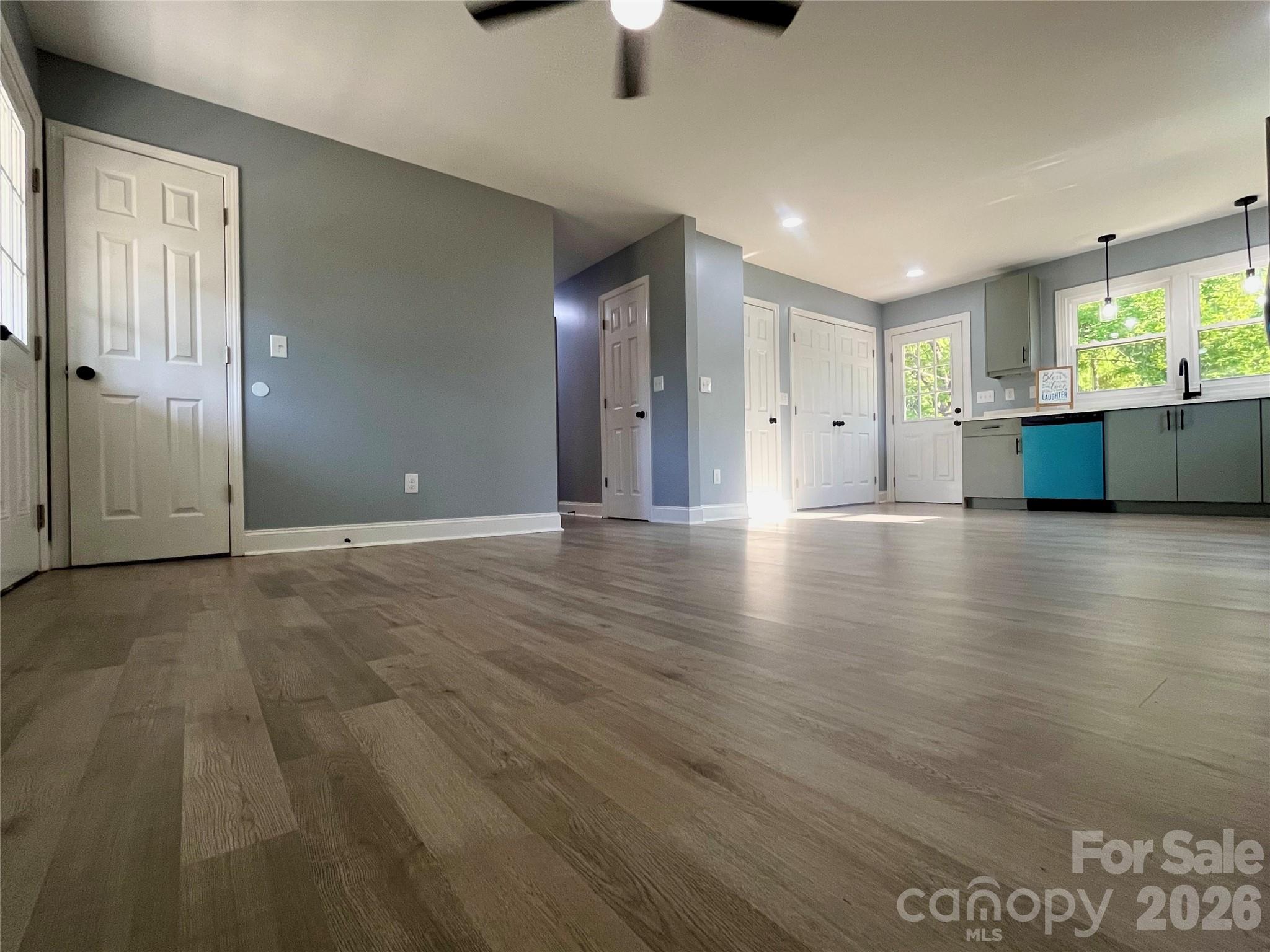 102 Arbor Court Chester, SC 29706 - Photo 12 of 42 a view of an empty room with window and wooden floor