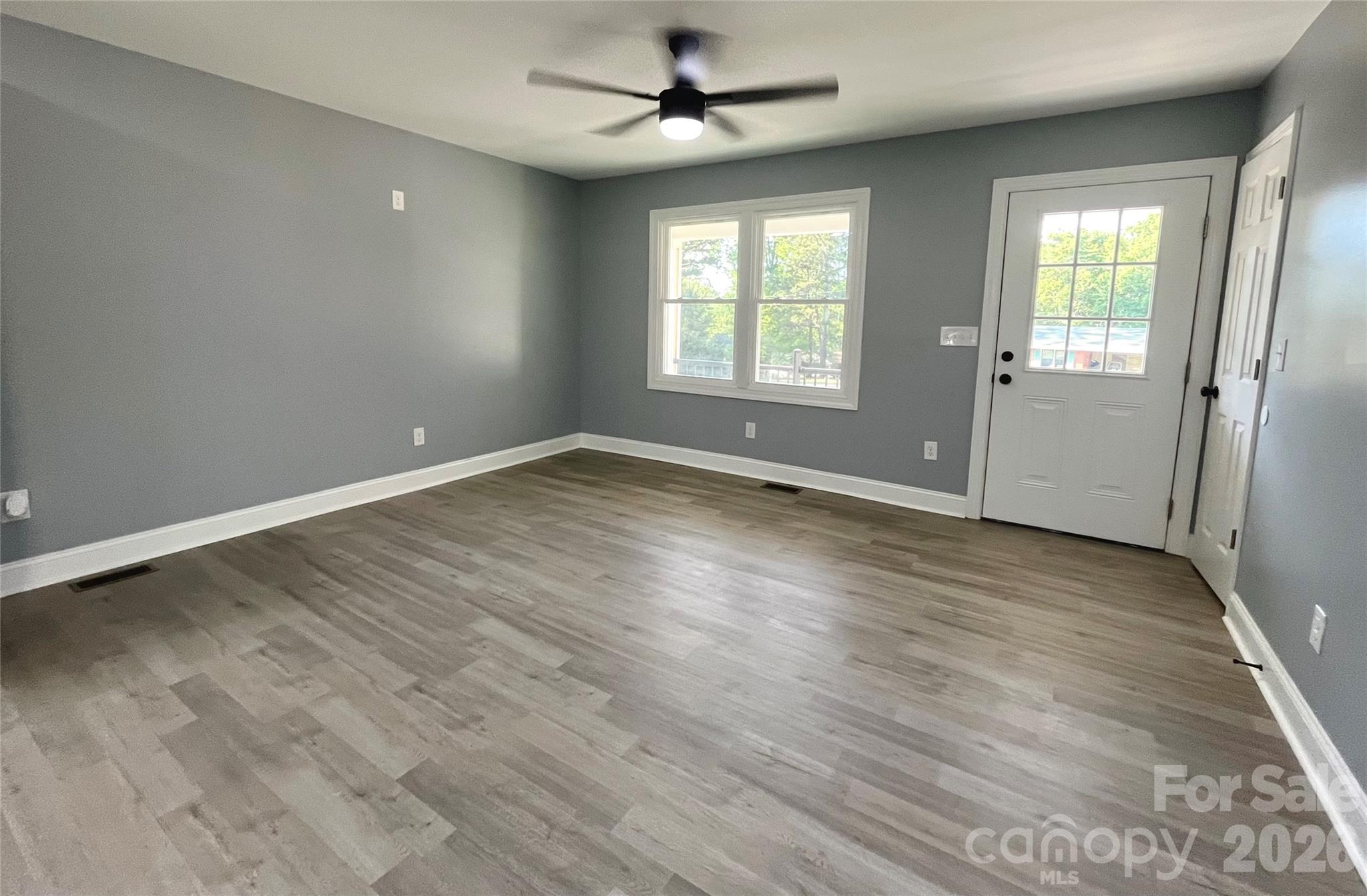 102 Arbor Court Chester, SC 29706 - Photo 13 of 42 wooden floor in an empty room with a window