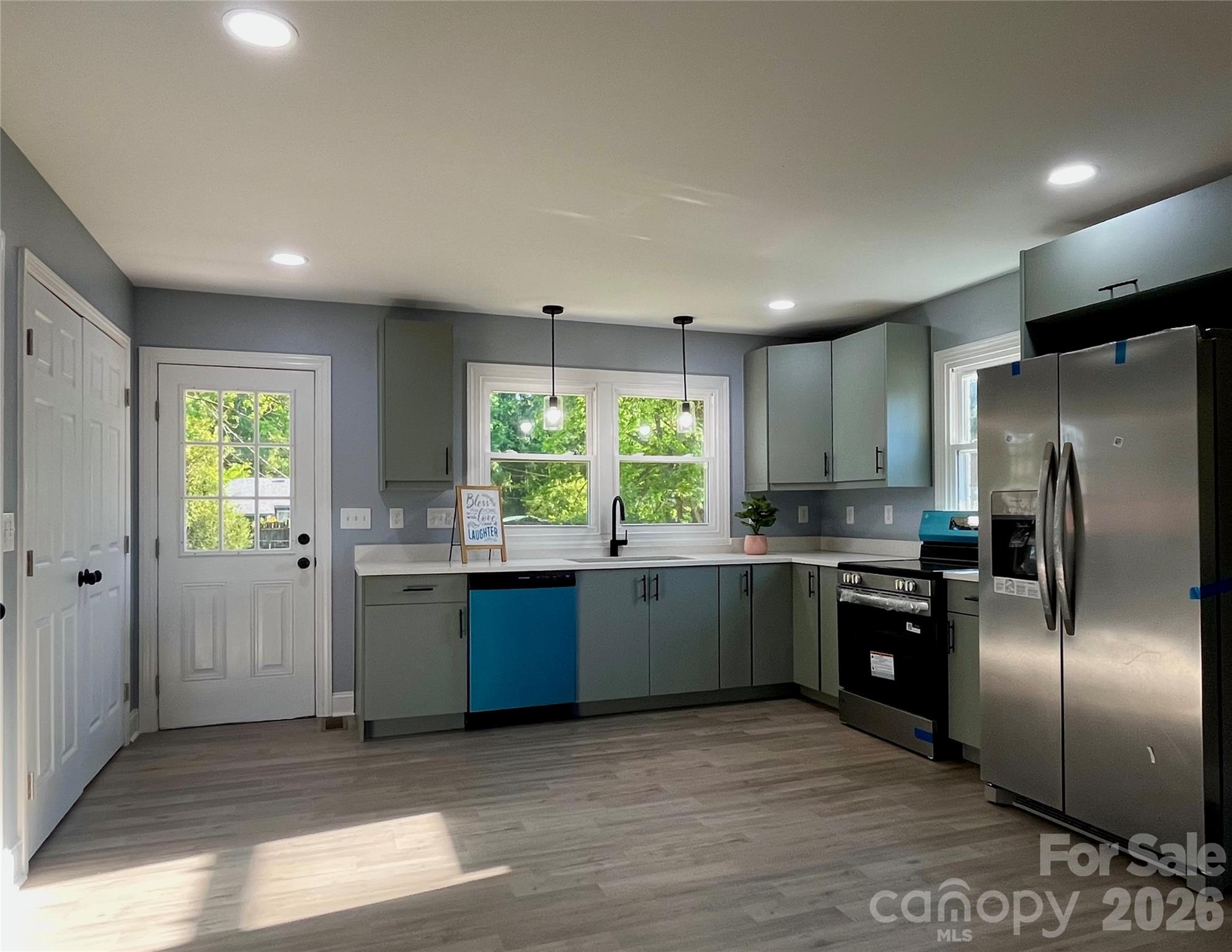 102 Arbor Court Chester, SC 29706 - Photo 14 of 42 a kitchen with stainless steel appliances granite countertop a refrigerator a sink a stove and cabinets