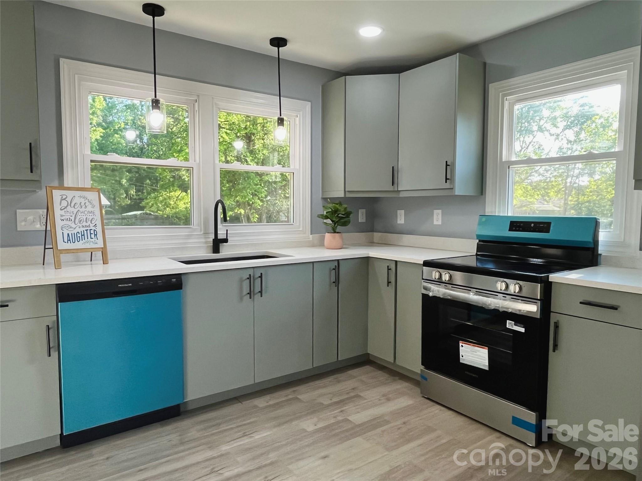 102 Arbor Court Chester, SC 29706 - Photo 16 of 42 a kitchen with a sink window and cabinets
