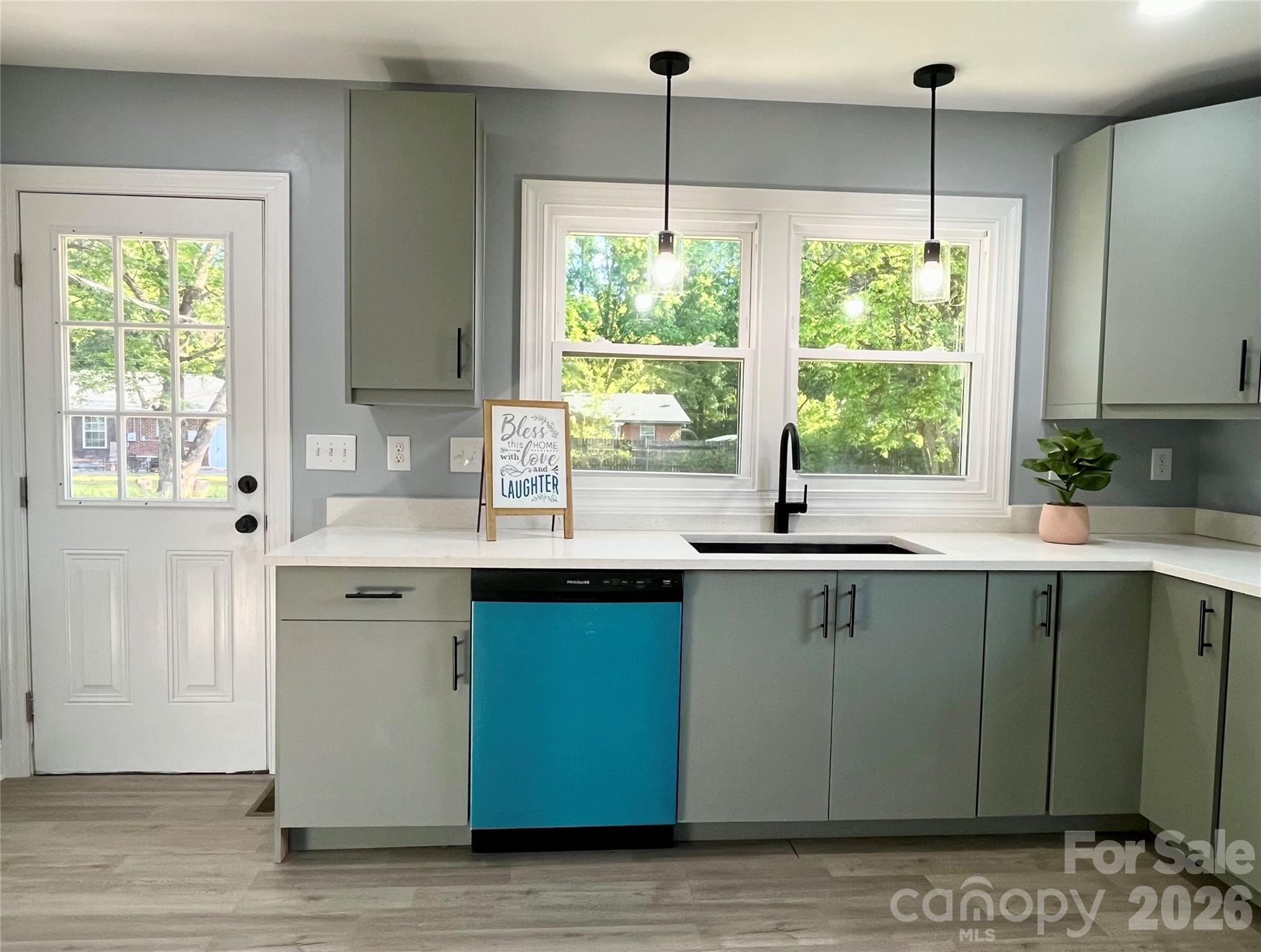 102 Arbor Court Chester, SC 29706 - Photo 17 of 42 a kitchen with stainless steel appliances granite countertop a sink window and cabinets