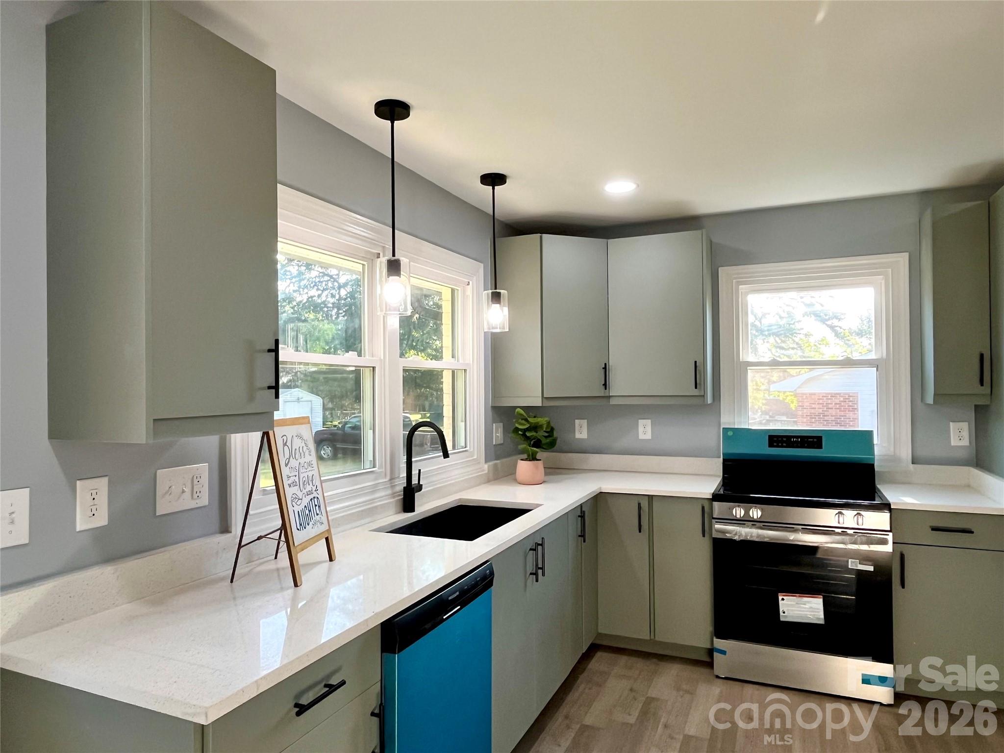 102 Arbor Court Chester, SC 29706 - Photo 18 of 42 a kitchen with a sink stove and cabinets