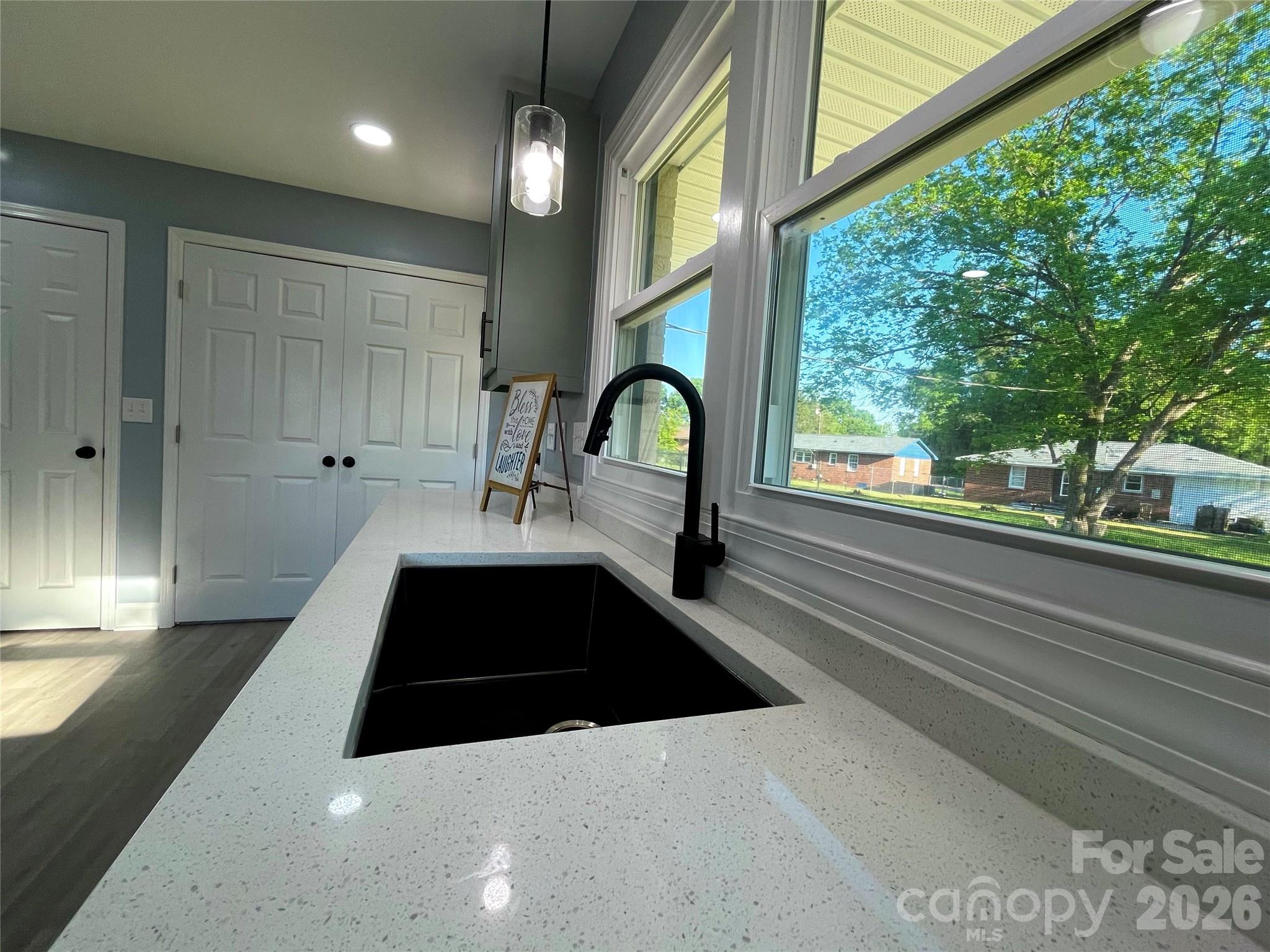102 Arbor Court Chester, SC 29706 - Photo 22 of 42 a large white kitchen with a large window